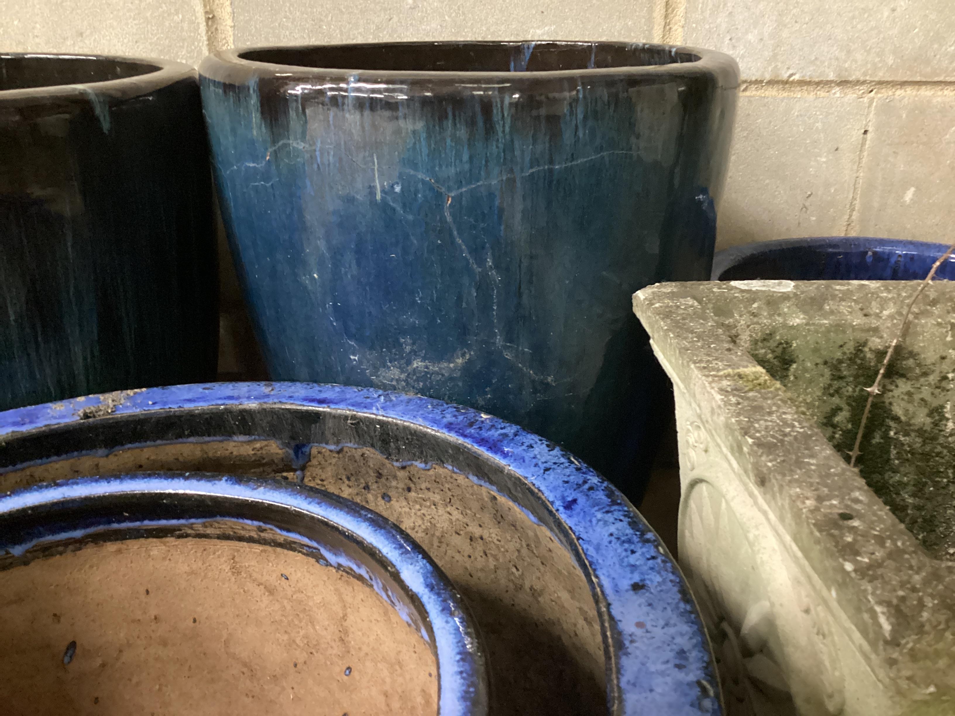 Seven assorted glazed earthenware and reconstituted stone garden planters, largest diameter 40cm, height 50cm